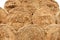 Haystacks background, texture. Hay storage in field. Hay prepared for farm animal feed in winter. Stacks dry hay open air field