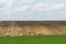 Haystacks harvest on agriculture farm fields. Farm field bales agriculture landscape. Haystack harvest landscape. The beet field