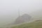 Haystacks in misty morning