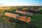 Haystacks near farm with cows and pigs. Hay in rolls at cowsheds. Haystack for Animal husbandry. Hay bale in Agriculture. Farm