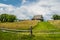 Haystacks and rural house