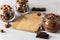 Hazelnut Almond and Chocolate Cream Chocolate Bar Glass Jars with Hazelnuts Almonds and Chocolate Gray Background Horizontal