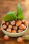 Hazelnuts bowl close-up on a wooden table. Farmed ripe hazelnuts. Nut abundance.Organic bio nuts. Healthy fats.