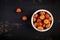 Hazelnuts on dark wooden background. A handful of nuts