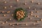 Hazelnuts in moss with badian on a wooden background.