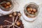 Hazelnuts in the peel and oatmeal cookies on brown table.  Oatmeal cookies  with crack pattern and nuts on  table in rustic style.