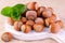 Hazelnuts on a white wooden board. Close-up.