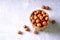 Hazelnuts in a wicker basket on the kitchen table. View above