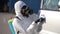 Hazmat team worker disinfects car door handles with antibacterial sanitizer wipe on coronavirus covid-19 quarantine. Man