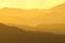 Hazy Layers of Mountain Ranges During Sunrise