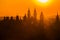 Hazy morning cityscape, orange and yellow sunrise