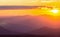 Hazy mountain range with dramatic sunset sky