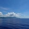 The hazy and mountainous coastline of the Caribbean Island of Haiti as a cruise ship sails by