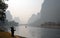 A hazy scene along the Li River between Guilin and Yangshuo in Guangxi Province, China