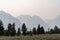 Hazy smoke in the air from nearby summer wildfires in the Grand Teton National Park in Wyoming. Poor visibility for mountains