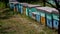 HD Honey Bee flying around Beehives in the field