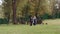 HD Walking in a park couple holding hands, woman pregnant with baby belly