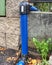 HDPE blue tube connected by bent part to city drinking water supply system
