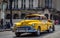 HDR - Beautiful american yellow vintage car drived in Havana Cuba - Serie Cuba Reportage
