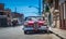 HDR - Beautiful red american vintage car in the front view parked in Havana Cuba - Serie Cuba Reportage