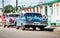 HDR Cuba countryside american blue vintage car parked on the road