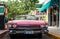 HDR Cuba pink american classic car on a gas station