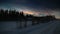 HDR image of nacreous clouds over Swedish farm buildings in winter