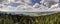 HDR panorama with forest mountains and cloudy sky