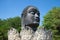 Head of the black Buddha in the Lotus flower. Wat Thammikaram. Ayutthaya, Thailand