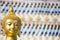 Head of buddha statue with color glass background