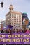 Head of the feminist march and group of protesters concentrated with a protest banner in one of the main streets of central Madrid