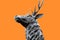 Head of a noble and beautiful and traditional british Deer Stag bronze, or alloy statue or sculpture cut out against a orange