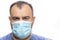 Head of the older man with blue surgical protective mask agains pandemic corona covid-19 virus