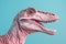 Head of pastel colored dinosaur on blue background