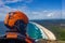 head of a pilot in a Gyrocopter with Wategoes Beach in the background, Byron Bay, Queensland, Australia