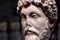Head of Roman emperor Marcus Aurelius, detail of an ancient marble statue