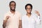 Head shot happy African American couple showing little size gesture