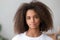 Head shot portrait attractive african teenager girl looking at camera