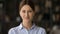 Head shot portrait of confident businesswoman entrepreneur looking at camera