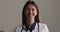 Head shot portrait female general practitioner smile look at camera