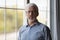 Head shot portrait grey haired senior confident man wearing glasses