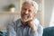 Head shot portrait of happy middle aged older retired man.