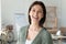 Head shot portrait overjoyed smiling young businesswoman standing in office