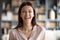 Head shot portrait overjoyed woman laughing, standing at home