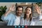 Head shot portrait screen view overjoyed couple waving hands