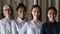 Head shot portrait of smiling diverse businesswoman employees feeling motivated