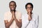 Head shot smiling African American couple holding hands in prayer