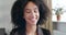 Head shot studio portrait of contented glad curly haired girl, teenager African ethnicity with toothy perfect smile