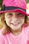 Head And Shoulders Portrait Of Girl Wearing Pink Straw Hat