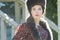 Head and shoulders portrait of Russian beautiful woman wearing fur Cossack hat and fur collar